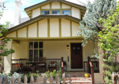 painted house with nice shade front porch