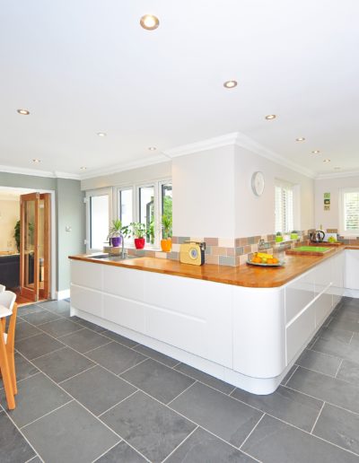white painted kitchen with contrast tile floors
