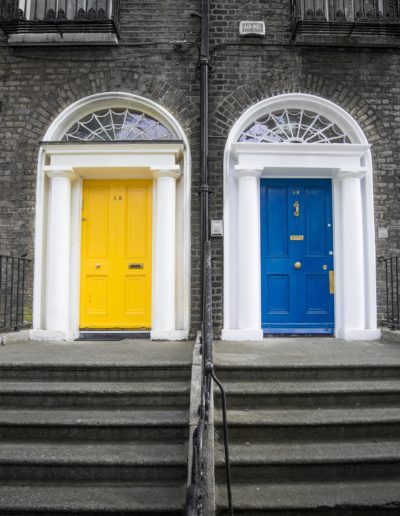 blue and yellow doors of city homes