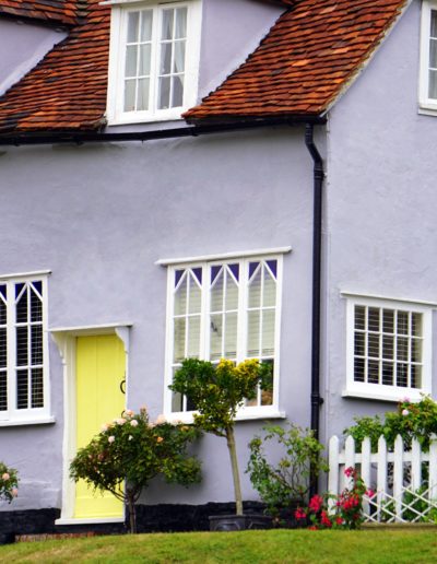 pastel purple cottage with wood shingles